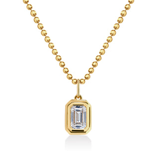 About:&nbsp;This emerald cut pendant necklace features a bezel set stone on a polished gold ball chain for a clean, structured look. Sleek and refined, it offers an elevated take on classic jewelry.

Diamond Details:&nbsp;Lab Grown Emerald Cut Diamond

Total Carat Weight:&nbsp;1 Carat

Color:&nbsp;E/F
Clarity:&nbsp;VS+

Metal:&nbsp;14K Gold&nbsp;

Available in 14K Yellow Gold and 14K White Gold&nbsp;

Chain Dimensions:

Length: Adjustable 16-18"
Width:&nbsp;1.5mm Ball Chain

Pendant Dimensions: Approx 11.2 