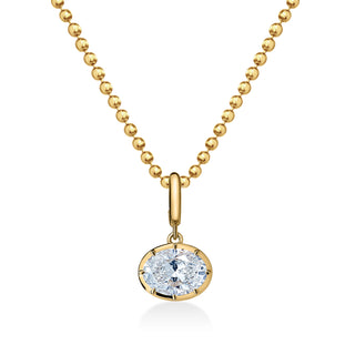 About: This east west set oval pendant necklace pairs a classic drop silhouette with a polished gold ball chain for an elevated finish.

Diamond Details: East West Set Oval Lab Grown Diamond

Total Carat Weight: Available in 2 or 3&nbsp;Carats

Metal: 14K Solid Gold

Available in 14K Yellow Gold, 14K White Gold, Two-tone (14K White Gold Front + 14K Yellow Gold Back + Bail), Two-tone (Black Rhodium Front + 14K Yellow Gold Back + Bail)

Chain Dimensions:

Length: Adjustable 16-18"
Width:&nbsp;1.5mm

Pendant D