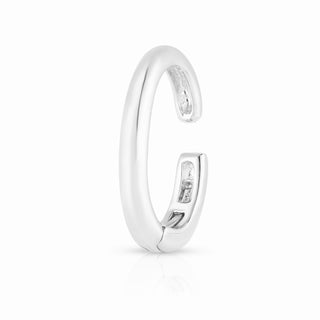 About: This cuff earring is crafted in 14K gold with a smooth, rounded silhouette that feels clean and sculptural. It makes an impact while still feeling minimal and easy to wear.

Metal:&nbsp;18K Solid Gold&nbsp;


Available in 18K Yellow Gold, and 18K White Gold

Width:&nbsp;2.3 mm&nbsp;

Length:&nbsp;12.7 mm

Closure:&nbsp;Latch Closure