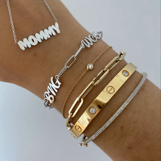 About: A classic paperclip bracelet with a clean, structured silhouette and a more substantial feel. Crafted in 14K gold, it adds a polished finish whether worn alone or layered.

Metal: 14K Solid Yellow Gold

Width: 4.30&nbsp;mm

Length: Adjustable 6-7"&nbsp;

Closure:&nbsp;Lobster clasp