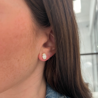 About: These oval stud earrings are set in 14K gold with a softly elongated silhouette that feels clean and balanced. Easy to wear and quietly refined, they add a polished finish to any look.

Diamond details: 2 Oval Shape Lab Grown Diamonds

Total Carat Weight: 2 Carats
Color: F
Clarity:&nbsp;VS

Metal: 14K Yellow Gold

Closure: Push Back