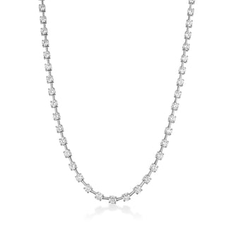 About: An elevated take on the classic tennis necklace, this piece features round diamonds set in yellow gold for a look that feels refined, clean, and endlessly wearable. Designed to catch the light with every movement, it layers beautifully but is striking enough to wear on its own.

Diamonds: Approx 62 Lab Grown Diamonds

Total Carat Weight: 10 Carats
Color:&nbsp;E/F
Clarity:&nbsp;VS

Metal:&nbsp;14K Solid Gold

Available in&nbsp;14K Yellow Gold and 14K White Gold

Length:&nbsp;16"

Closure:&nbsp;Push Cl