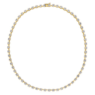 About: An elevated take on the classic tennis necklace, this piece features round diamonds set in yellow gold for a look that feels refined, clean, and endlessly wearable. Designed to catch the light with every movement, it layers beautifully but is striking enough to wear on its own.

Diamonds: Approx 62 Lab Grown Diamonds

Total Carat Weight: 10 Carats
Color:&nbsp;E/F
Clarity:&nbsp;VS

Metal:&nbsp;14K Solid Gold

Available in&nbsp;14K Yellow Gold and 14K White Gold

Length:&nbsp;16"

Closure:&nbsp;Push Cl