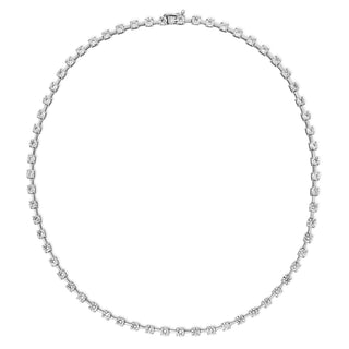 About: An elevated take on the classic tennis necklace, this piece features round diamonds set in yellow gold for a look that feels refined, clean, and endlessly wearable. Designed to catch the light with every movement, it layers beautifully but is striking enough to wear on its own.

Diamonds: Approx 62 Lab Grown Diamonds

Total Carat Weight: 10 Carats
Color:&nbsp;E/F
Clarity:&nbsp;VS

Metal:&nbsp;14K Solid Gold

Available in&nbsp;14K Yellow Gold and 14K White Gold

Length:&nbsp;16"

Closure:&nbsp;Push Cl