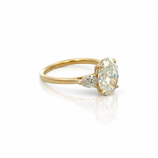 Oval Diamond Engagement Ring With Pear Side Stones