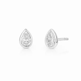 About: These pear shape stud earrings are framed in 14K gold for a clean, elegant finish. Refined and easy to wear, they bring a subtle point of shape and shine to everyday styling.

Diamond Details: 2 Pear Shape Lab Grown Diamonds

Total Carat Weight: 0.50 Carats
Color: E/F
Clarity: VS

Metal:&nbsp;14K Solid Gold&nbsp;

Available in&nbsp;14K Yellow Gold and 14K White Gold

Closure: Push Back