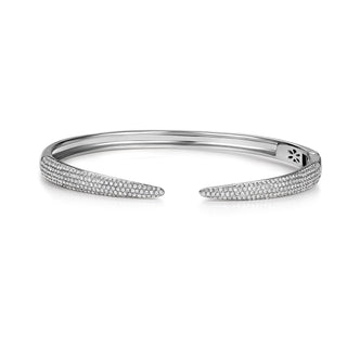 About: This pavé cuff bracelet features a sleek open silhouette with tapered ends lined in round diamonds. Crafted in 14K gold, it feels sculptural, polished, and quietly statement making.

Diamond Details: 340 Pavé Natural Diamonds

Total Carat Weight: 0.82 Carats
Color: G/H
Clarity: SI

Metal: 14K Solid Gold&nbsp;

Lengths: Available in 15, 16, 17, 18, and 19 cm

Closure: Hinge closing&nbsp;