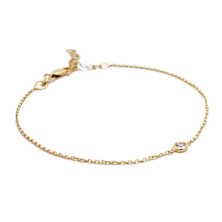 About: A single bezel set diamond gives this delicate bracelet a clean, understated focal point. Crafted in 14K gold, it layers effortlessly and adds a subtle finish to everyday wear.

Diamond Details: 1 Round Natural Diamond&nbsp;

Total Carat Weight: 0.05 Carats
Color: G/H
Clarity: SI
Metal:&nbsp;14K Solid Gold&nbsp;
&nbsp;
Width:&nbsp;2 mm&nbsp;


Length:&nbsp;Adjustable 6.5-7"


Closure:&nbsp;Lobster clasp