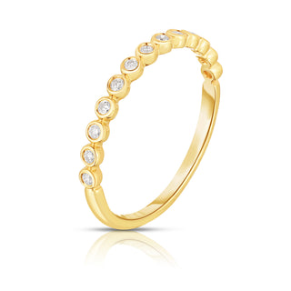About: This bezel set band ring has a smooth, continuous look that feels clean and considered from every angle. Crafted in 14K gold with round stones throughout, it brings a subtle graphic quality to a classic diamond band.

Diamond Details: Round Natural Diamonds&nbsp;

Total Carat Weight:&nbsp;0.13 Carats
Color:&nbsp;G/H
Clarity:&nbsp;SI

Metal:&nbsp;14K Solid Gold&nbsp;

Available in 14k Yellow Gold, 14k White Gold, 14k Rose Gold

Production requires 2-3 weeks.