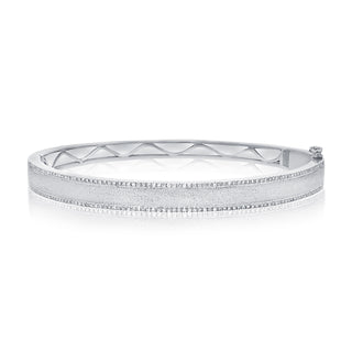 About:&nbsp;This diamond bangle pairs 14K gold with fine rows of pavé diamonds for a look that feels both subtle and distinctive. Clean, sculptural, and easy to style, it adds a refined layer to any wrist stack.

Diamond Details:&nbsp;Pavé Natural Diamonds

Total Carat Weight: 0.74 Carats
Color: G/H
Clarity: SI

Metal: 14K Solid Gold

Available in 14K Yellow Gold, and 14K White Gold

Lengths: Available in 15, 16, 17, 18, and 19 cm

Closure:&nbsp;Push clasp with safety latch&nbsp;