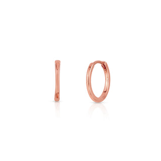 About: These huggie earrings are crafted in 14K gold with a slim, streamlined silhouette. Clean and understated, they are an easy everyday staple.

Metal: 14K Solid Gold

Available in 14K Yellow Gold, 14K White Gold and 14K Rose Gold

Width: 1.6 mm

Diameter:&nbsp;12 mm

Closure: Latch&nbsp;