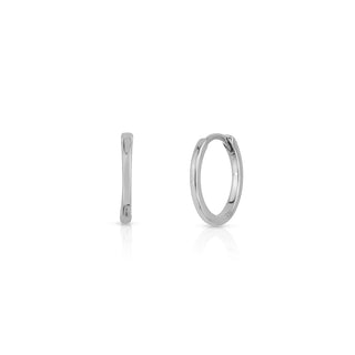 About: These huggie earrings are crafted in 14K gold with a slim, streamlined silhouette. Clean and understated, they are an easy everyday staple.

Metal: 14K Solid Gold

Available in 14K Yellow Gold, 14K White Gold and 14K Rose Gold

Width: 1.6 mm

Diameter:&nbsp;12 mm

Closure: Latch&nbsp;