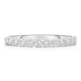 About: This bezel set band ring has a smooth, continuous look that feels clean and considered from every angle. Crafted in 14K gold with round stones throughout, it brings a subtle graphic quality to a classic diamond band.

Diamond Details: Round Natural Diamonds&nbsp;

Total Carat Weight:&nbsp;0.13 Carats
Color:&nbsp;G/H
Clarity:&nbsp;SI

Metal:&nbsp;14K Solid Gold&nbsp;

Available in 14k Yellow Gold, 14k White Gold, 14k Rose Gold

Production requires 2-3 weeks.