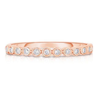 About: This bezel set band ring has a smooth, continuous look that feels clean and considered from every angle. Crafted in 14K gold with round stones throughout, it brings a subtle graphic quality to a classic diamond band.

Diamond Details: Round Natural Diamonds&nbsp;

Total Carat Weight:&nbsp;0.13 Carats
Color:&nbsp;G/H
Clarity:&nbsp;SI

Metal:&nbsp;14K Solid Gold&nbsp;

Available in 14k Yellow Gold, 14k White Gold, 14k Rose Gold

Production requires 2-3 weeks.